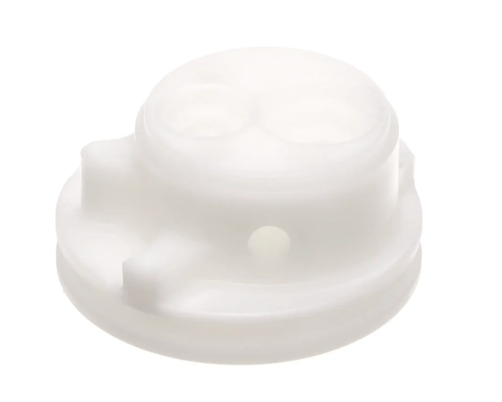 a white plastic object with holes