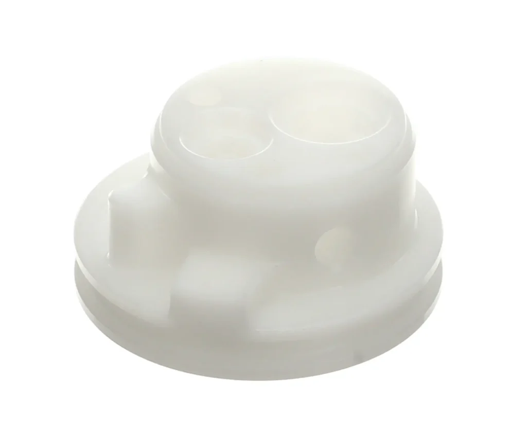 a white plastic object with holes