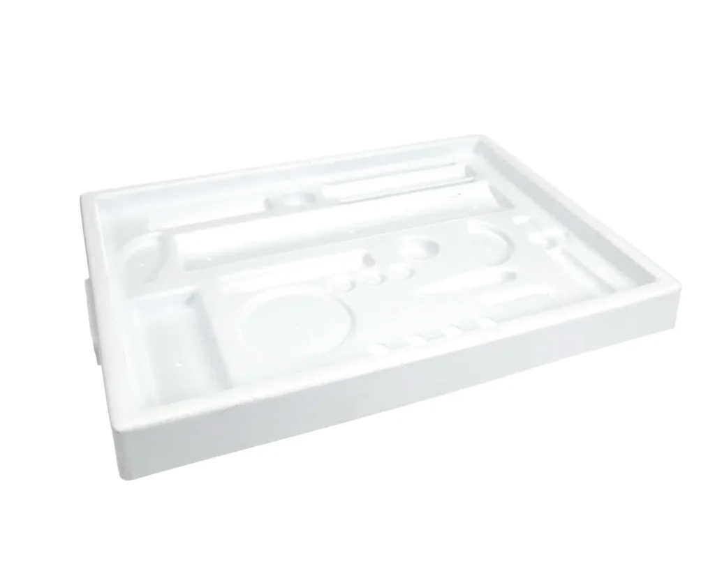 a white plastic tray with different tools