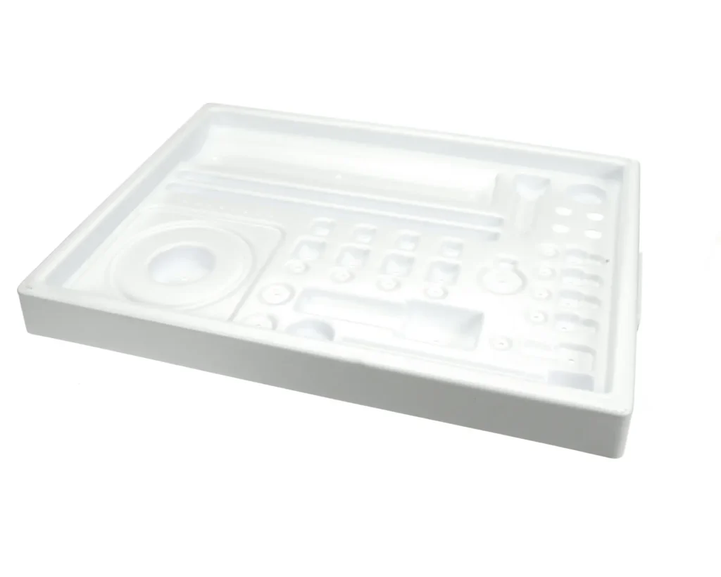a white plastic object with different shapes