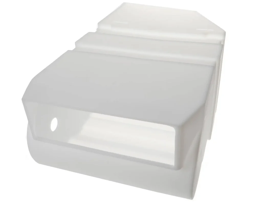 a white plastic object with a hole