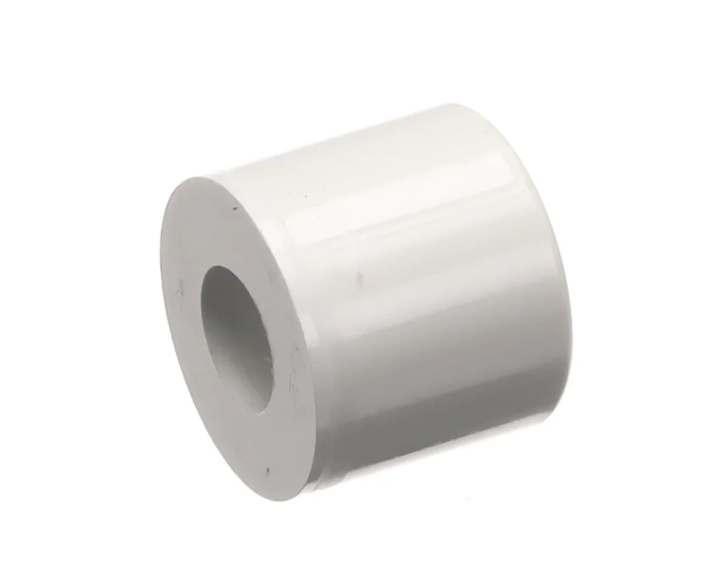 a white plastic pipe with a hole