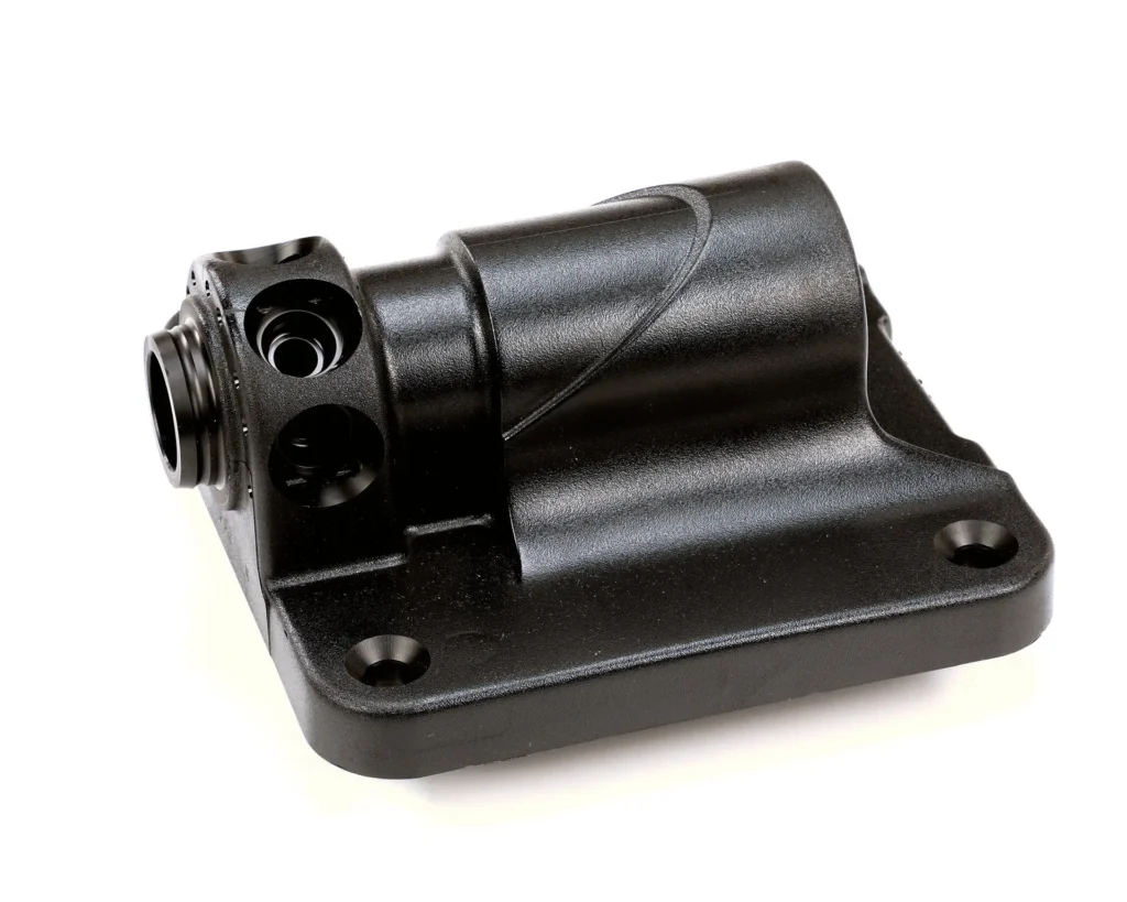 a black metal object with holes