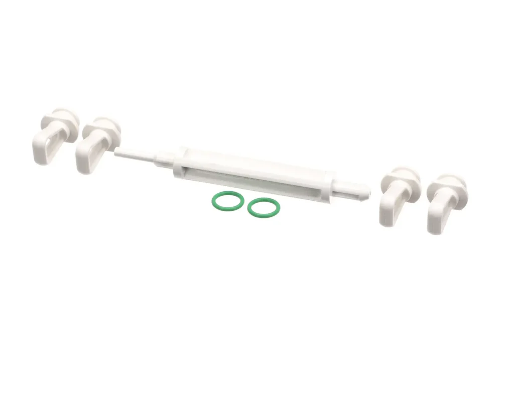 a white plastic device with a green ring and a white tube