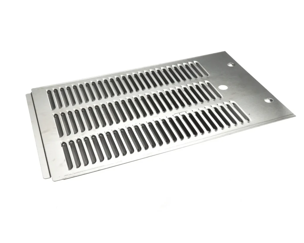 a metal grate with holes