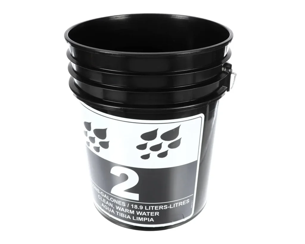 a black bucket with a white label