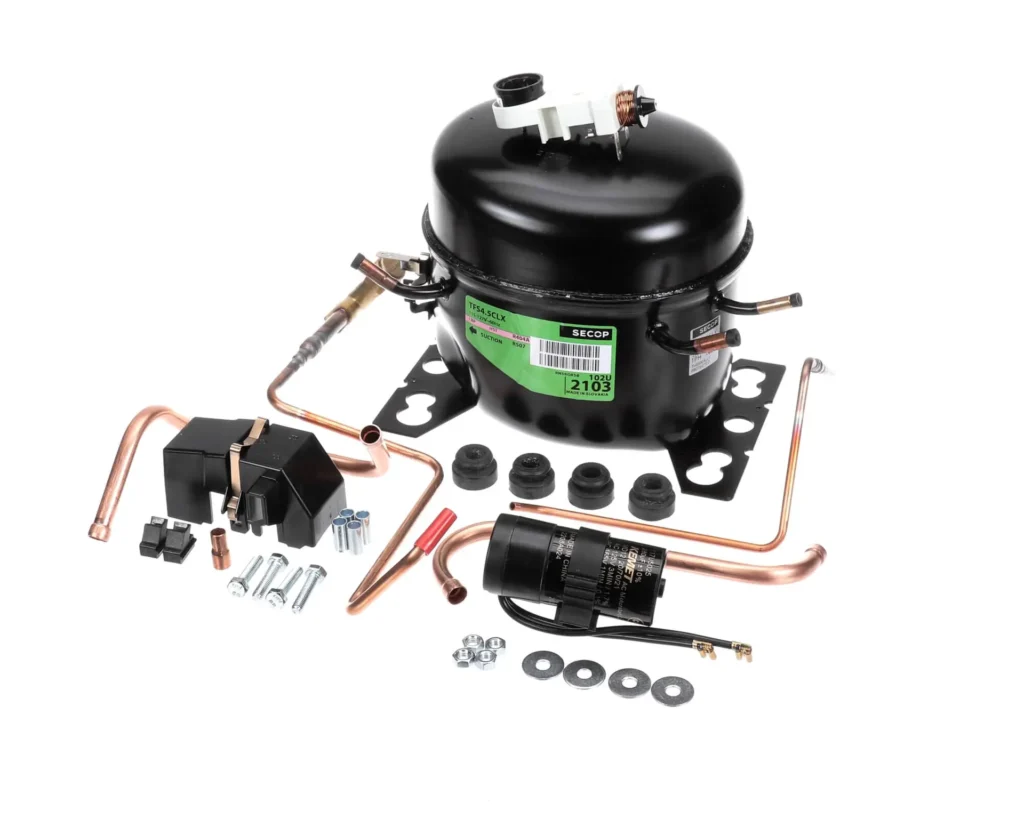 a black machine with copper pipes and a green label