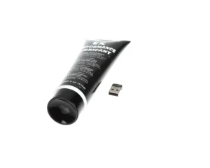a black tube with white text and a usb stick