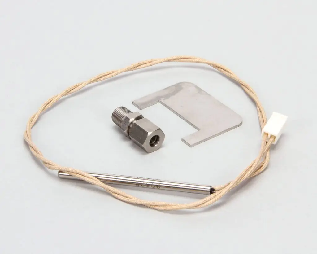 a metal piece of equipment with a wire