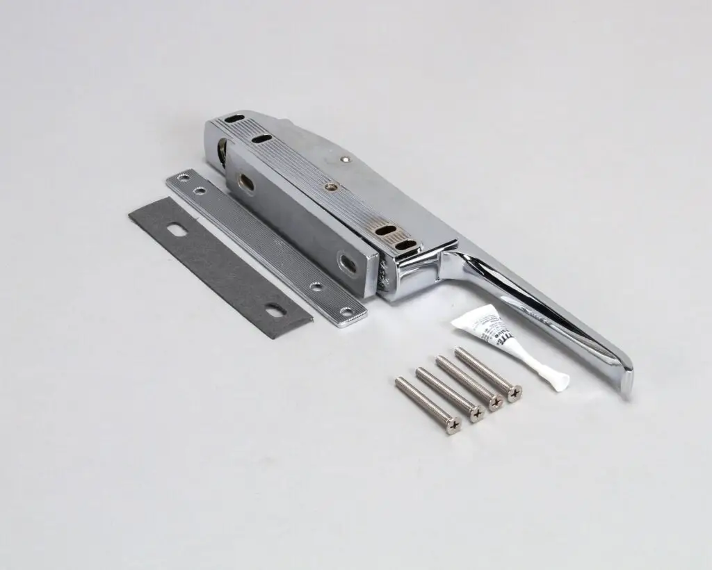 a metal door latch with screws