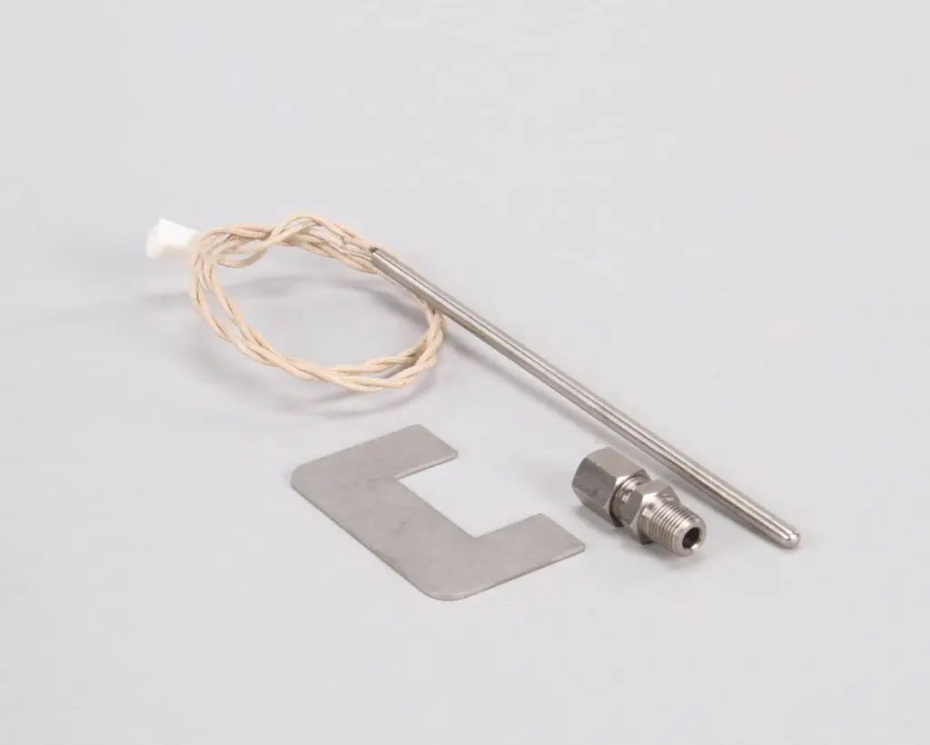 a metal object with a cord and a piece of metal
