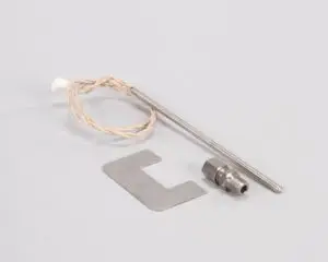 a metal object with a cord and a piece of metal