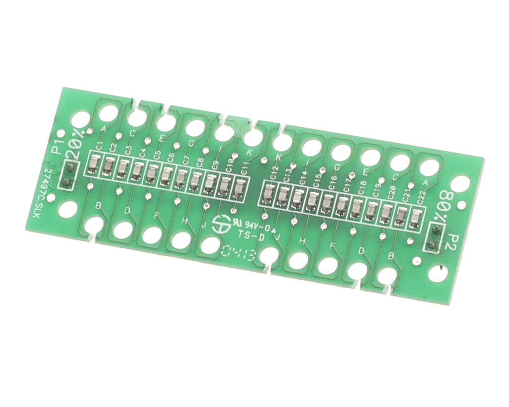 a green circuit board with many small holes