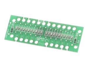 a green circuit board with many small holes