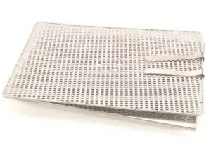a metal tray with holes on it