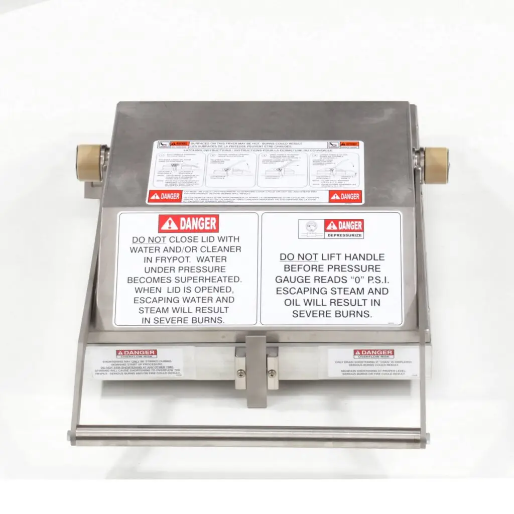 a metal box with warning labels