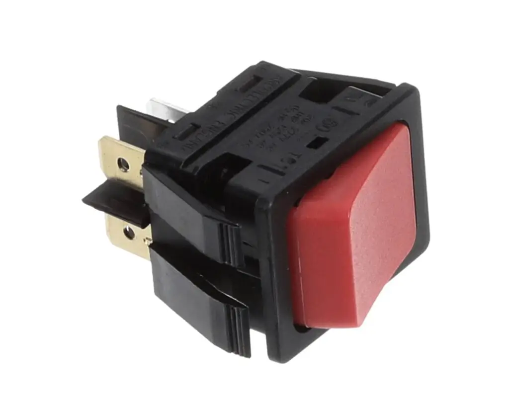 a red button with black cover