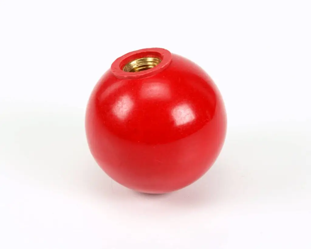 a red ball with a nut