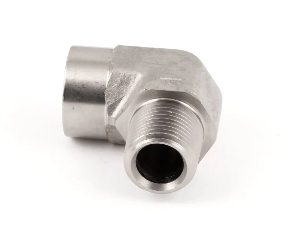 a silver metal pipe with a nozzle
