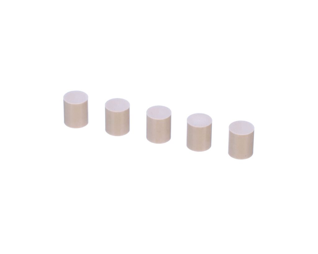 a row of white cylinder shaped objects