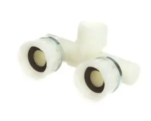 a white plastic pipe with two holes