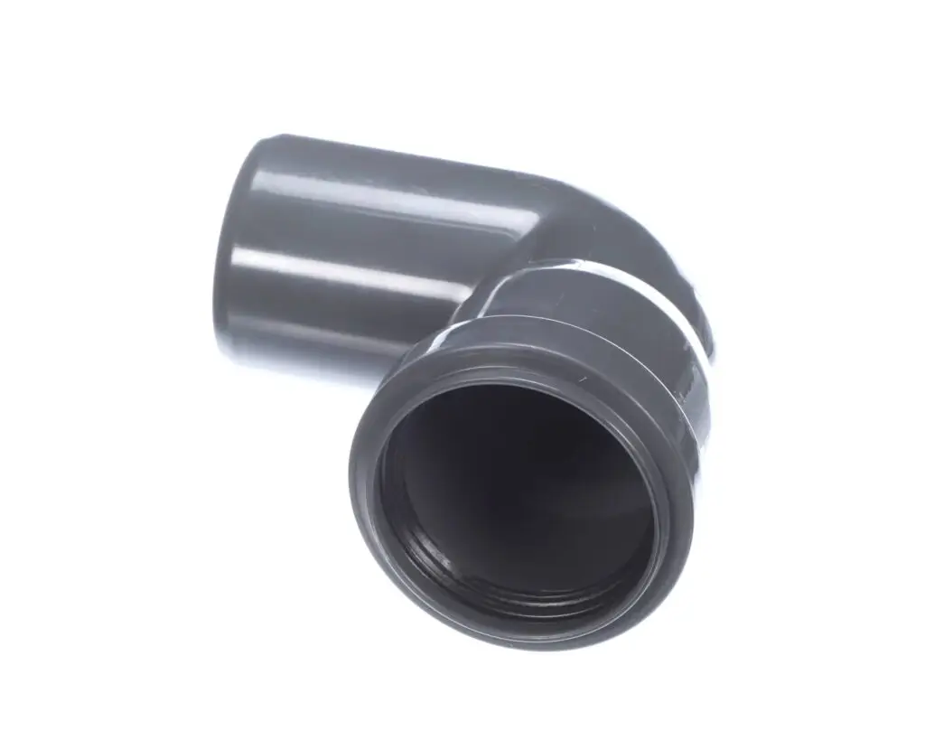 a grey plastic pipe with a hole