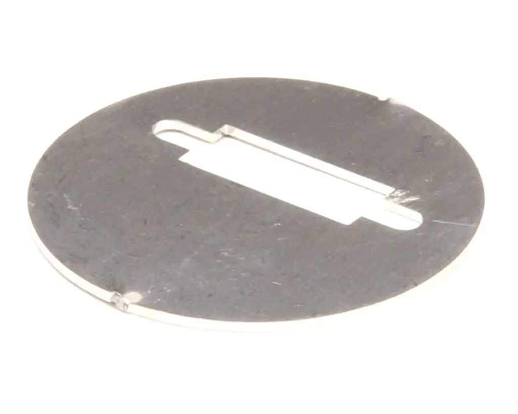 a circular metal object with a hole in the middle